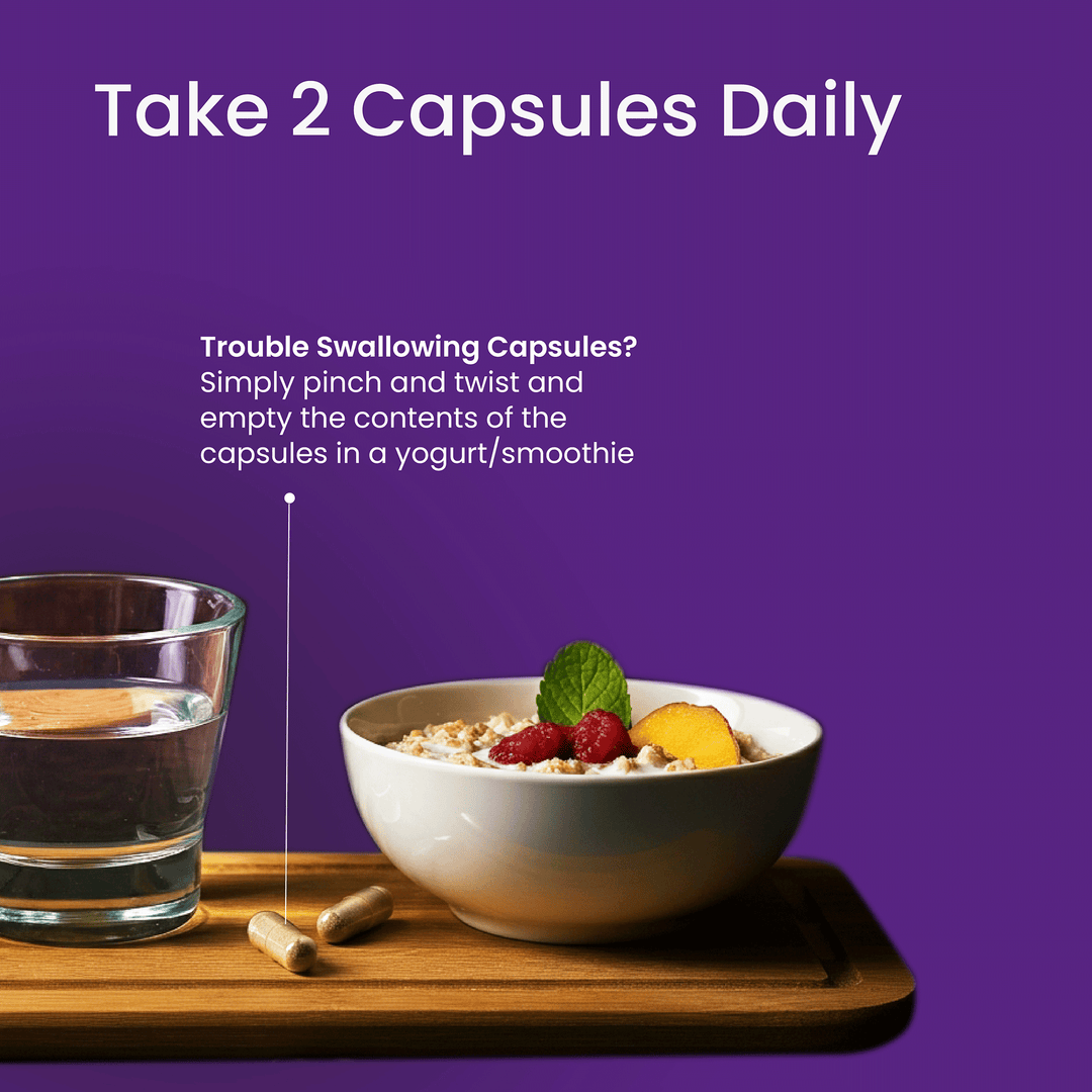 Bowl of cereal with fruit, glass of water, and capsules on a wooden tray with purple background