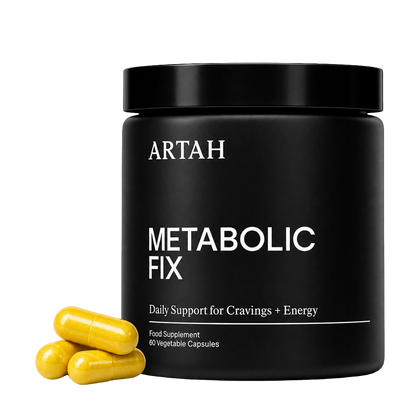 A black cylindrical supplement jar labeled ARTAH METABOLIC FIX with three yellow capsules placed in front on a white background.