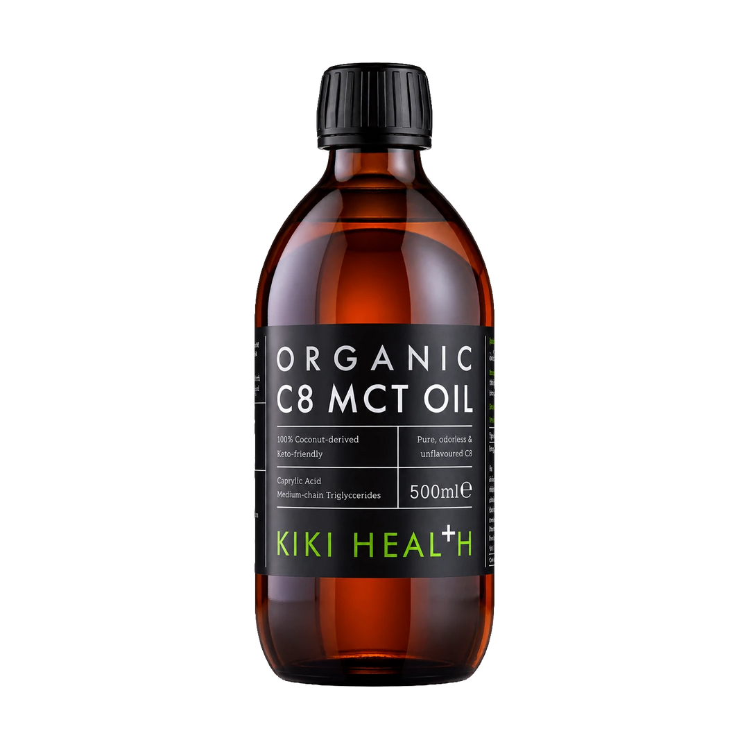 A 500ml amber glass bottle of Kiki Health Organic C8 MCT Oil with a black ribbed cap and a black label featuring white and green text.