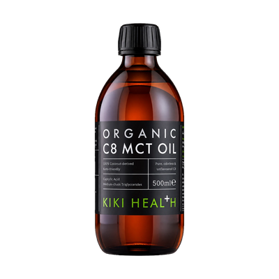 A 500ml amber glass bottle of Kiki Health Organic C8 MCT Oil with a black ribbed cap and a black label featuring white and green text.