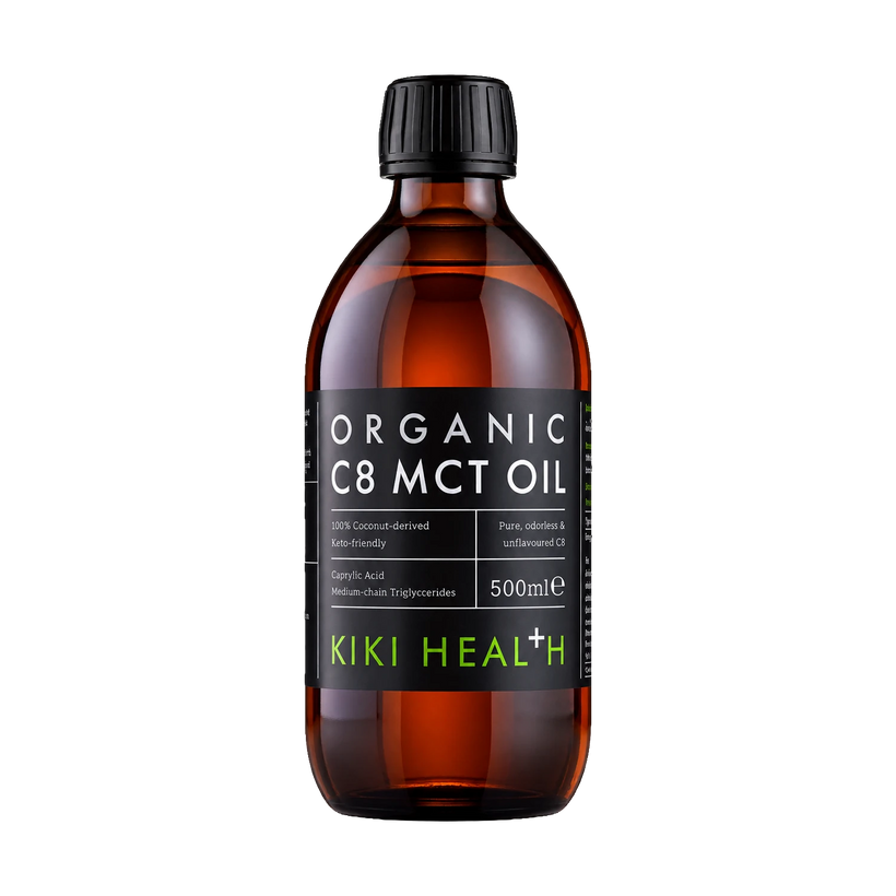 A 500ml amber glass bottle of Kiki Health Organic C8 MCT Oil with a black ribbed cap and a black label featuring white and green text.