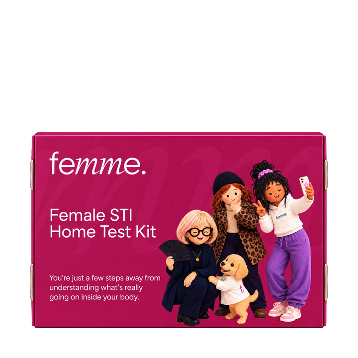A magenta box for the femme Female STI Home Test Kit, featuring white text and an illustration of four diverse women and a small dog on the front.