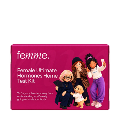 A bright pink rectangular product box for the femme Female Ultimate Hormones Home Test Kit, featuring white text and an illustration of four dolls and a small dog on the front.
