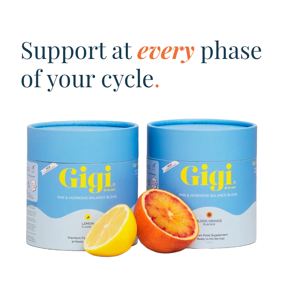 Two Gigi pre & hormone balance blend supplement tins in blue packaging, shown with lemon and blood orange slices on a white background, with the text 'Support at every phase of your cycle.' above them.