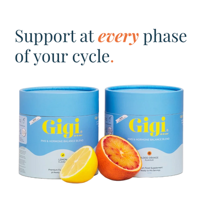 Two Gigi pre & hormone balance blend supplement tins in blue packaging, shown with lemon and blood orange slices on a white background, with the text 'Support at every phase of your cycle.' above them.