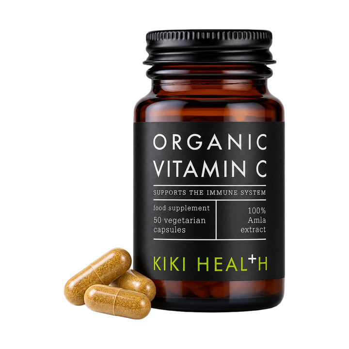 A bottle of Kiki Health Organic Vitamin C food supplement with three capsules placed in front on a clean white background.
