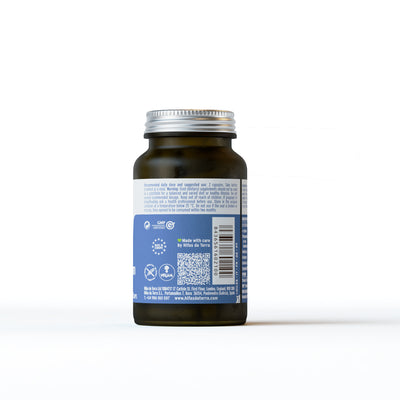 A bottle of dietary supplement capsules labelled Made with care by Hifas da Terra, showing GMP certified and vegan symbols.
