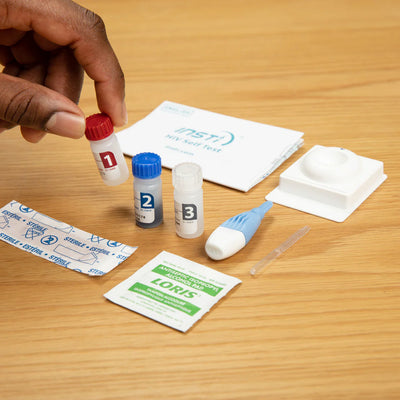 Collection of medical supplies on a wooden surface
