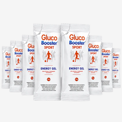 Eight packets of Gluco Booster Sport Energy Gel arranged in two rows of four. Each packet shows an illustration of people playing football.