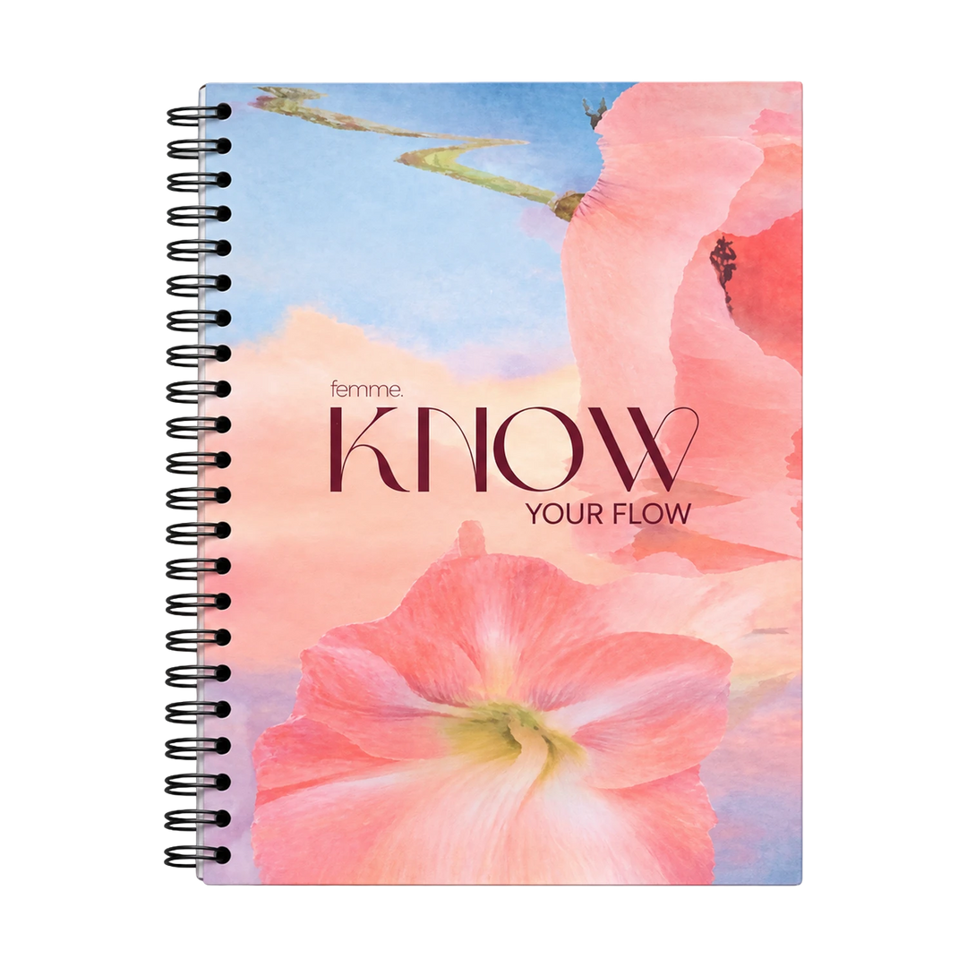 A spiral-bound notebook with a floral cover design featuring pink flowers and the text 'femme KNOW YOUR FLOW' on a white background.