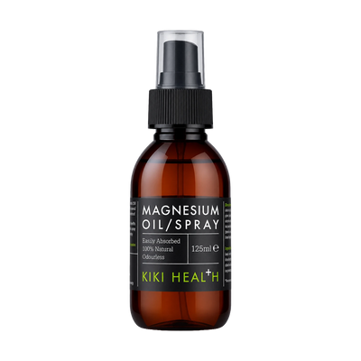 A 125ml amber glass bottle of Kiki Health Magnesium Oil Spray with a black spray nozzle and a black label featuring green brand text, set against a plain white background.