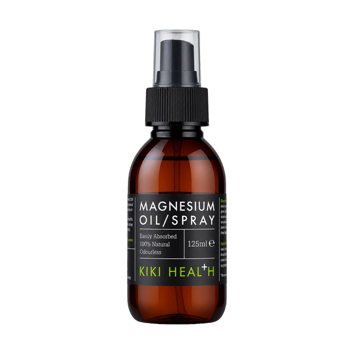 A 125ml amber glass bottle of Kiki Health Magnesium Oil Spray with a black spray nozzle and a black label featuring green brand text, set against a plain white background.