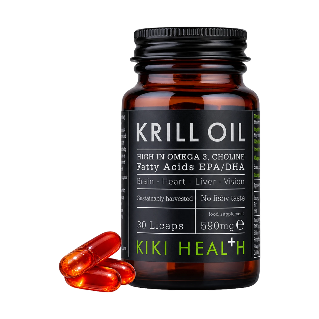 A bottle of Kiki Health+ Krill Oil capsules with three capsules beside it.