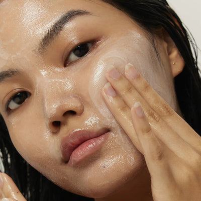 Person applying a skincare product to their face