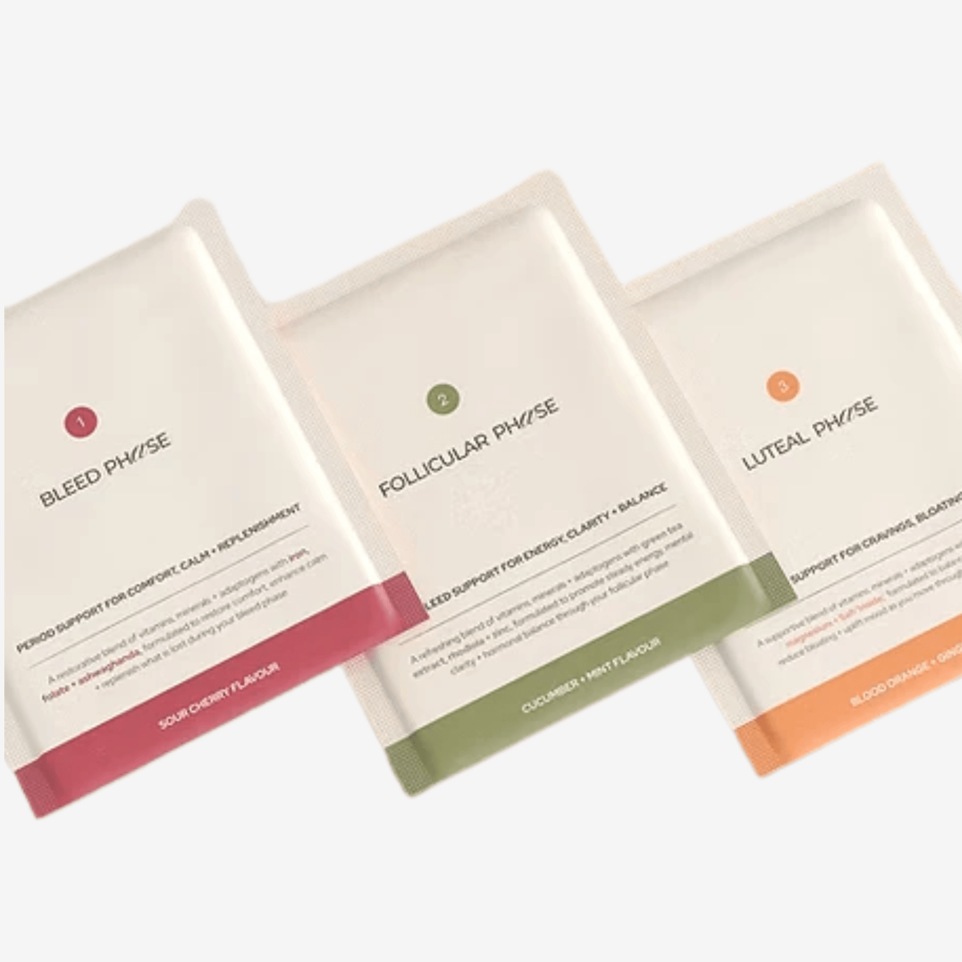 Three menstrual support sachets on plain background