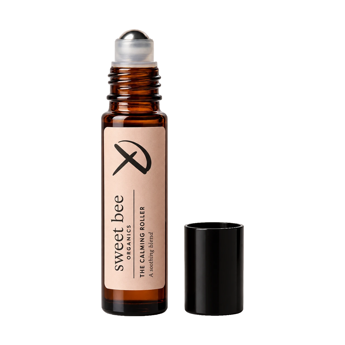 One amber glass roll-on bottle labeled 'sweet bee' is arranged on a transparent background. The bottle is open with its black cap placed beside it.