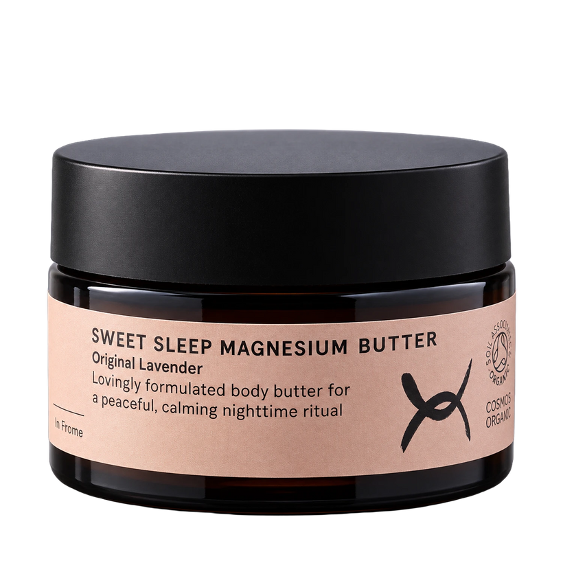 A dark amber glass jar of 'Sweet Sleep Magnesium Butter' with a matte black lid and a light pink label, shown on a solid white background.