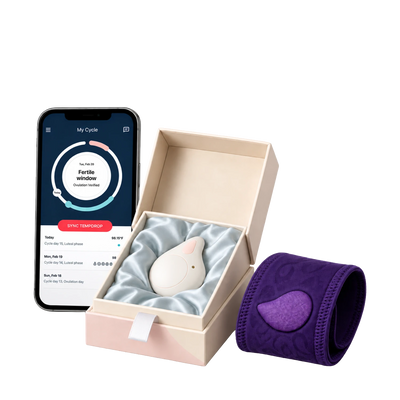 A smartphone displaying My Cycle app showing Fertile window and Sync Tempdrop button alongside an open box containing a white device and a purple wristband.