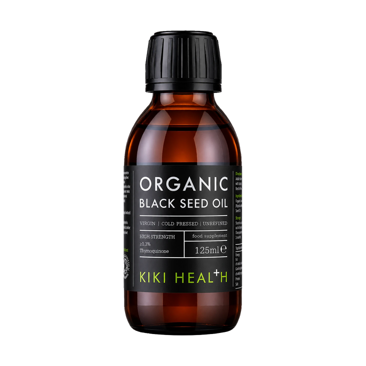 A 125ml bottle of Kiki Health+ Organic Black Seed Oil in an amber glass bottle with a black cap and black label, shown on a solid white background.