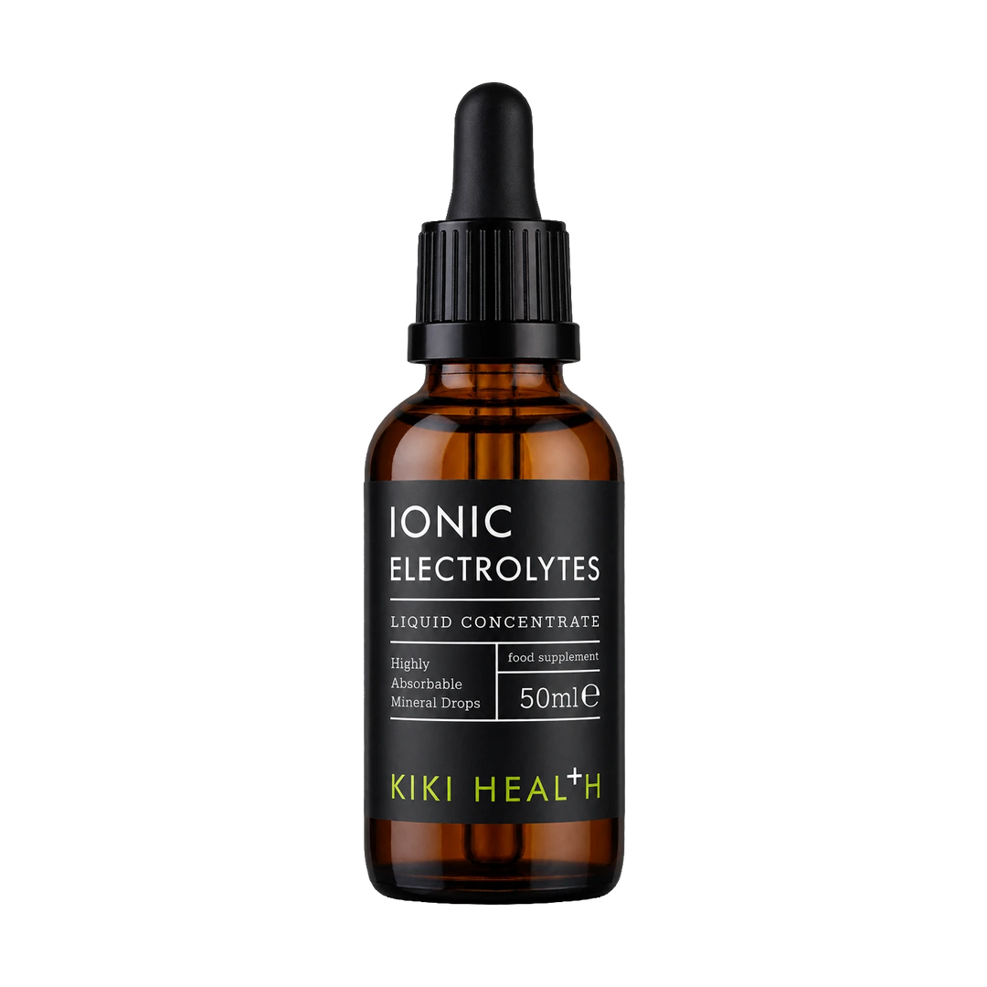 A 50ml amber glass dropper bottle of Kiki Health Ionic Electrolytes liquid concentrate, featuring a black label with white and lime green text, set against a plain white background.