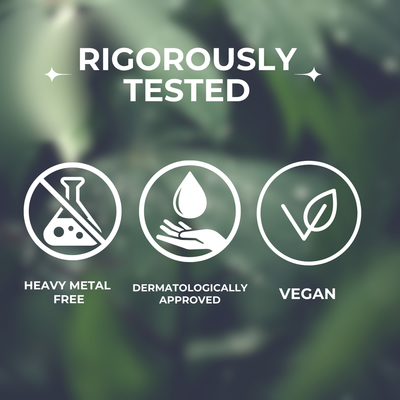 Certification icons for heavy metal free, dermatologically approved, and vegan products on a green leafy background.